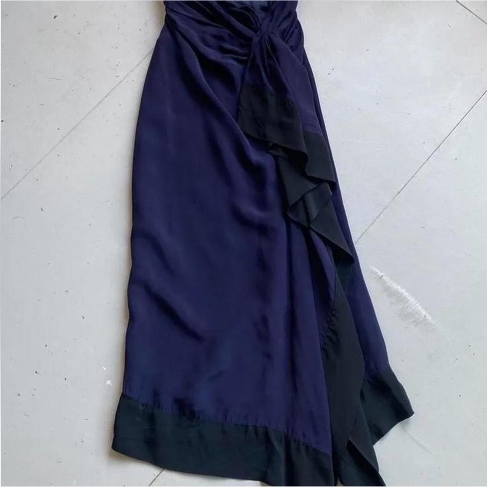 New with tags dries van noten purple maxi skirt with black trim.